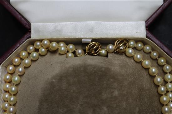 A Mikimoto pearl single strand long necklace with gold ball clasp (tests as 18ct) in Mikimoto box, 50 cm.